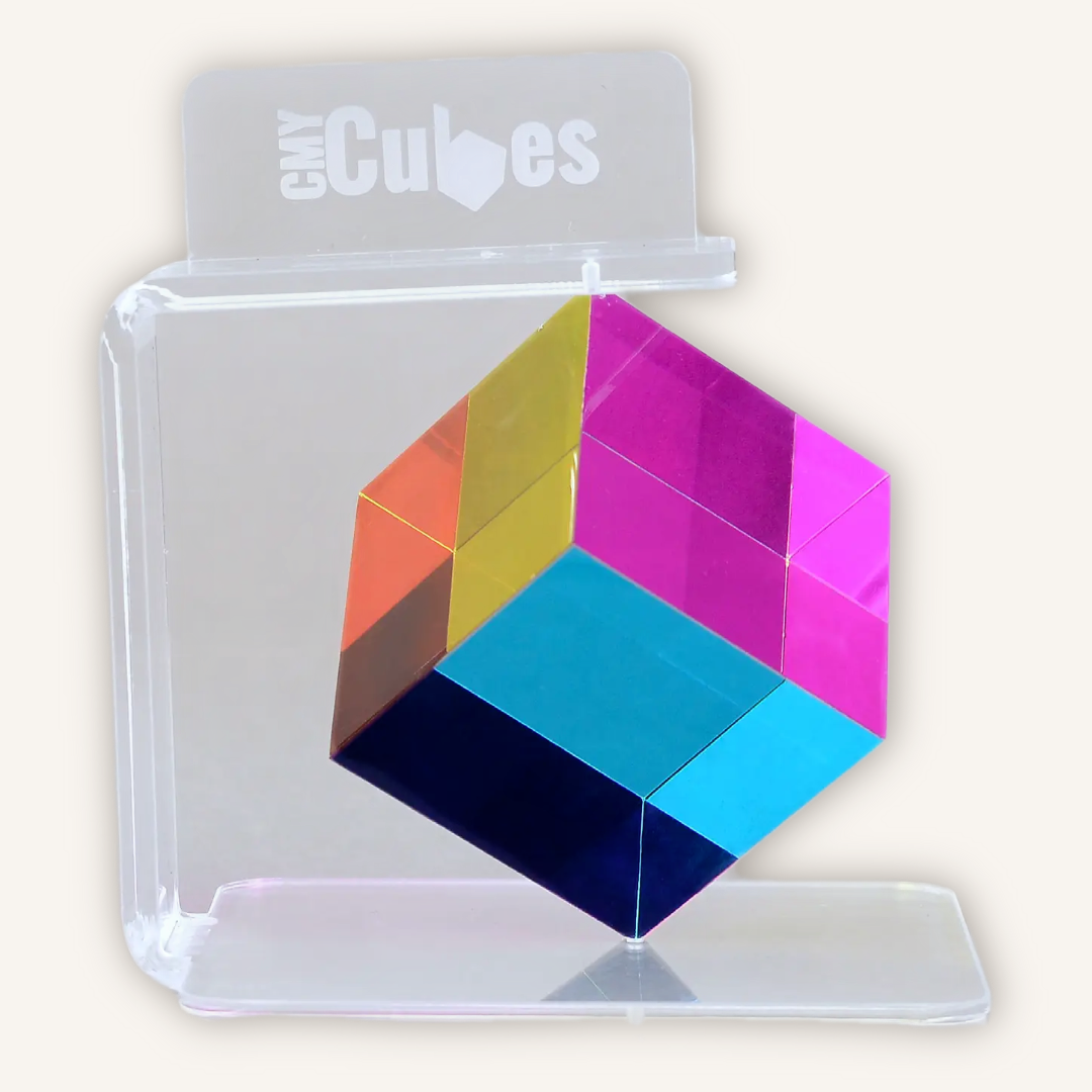 Official CMY Cubes GyroStand 360-degree display stand designed for the Original 50mm CMY Cube, shown holding the cube securely for spinning visual display.