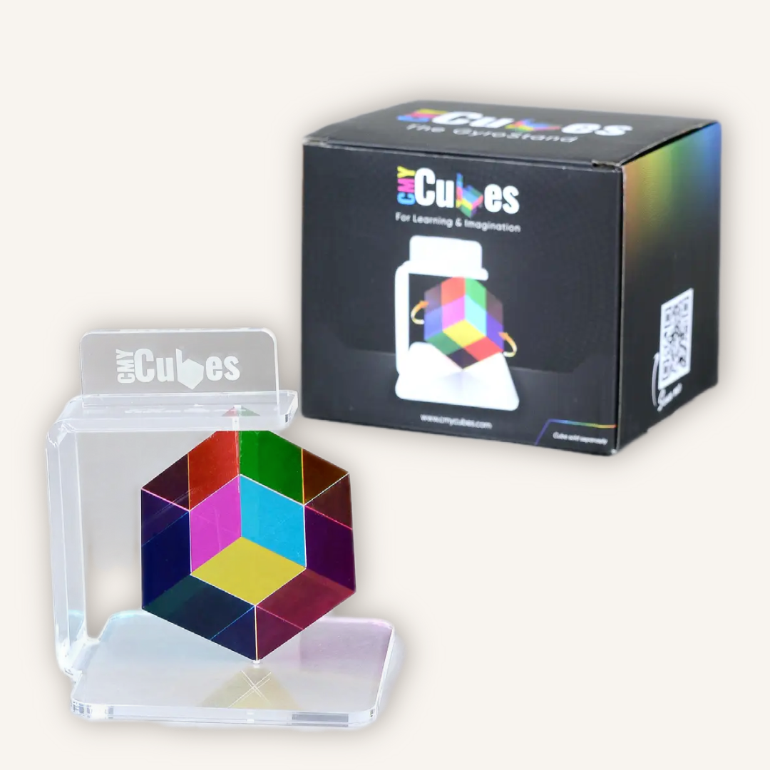 Official CMY Cubes GyroStand with retail packaging, a 360-degree spinning display stand designed for the Original 50mm CMY Cube.