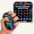 CMY Cubes PolySquish Series 2 being squeezed by hand, showing its soft tactile texture, geometric shape and colour-shifting finish.