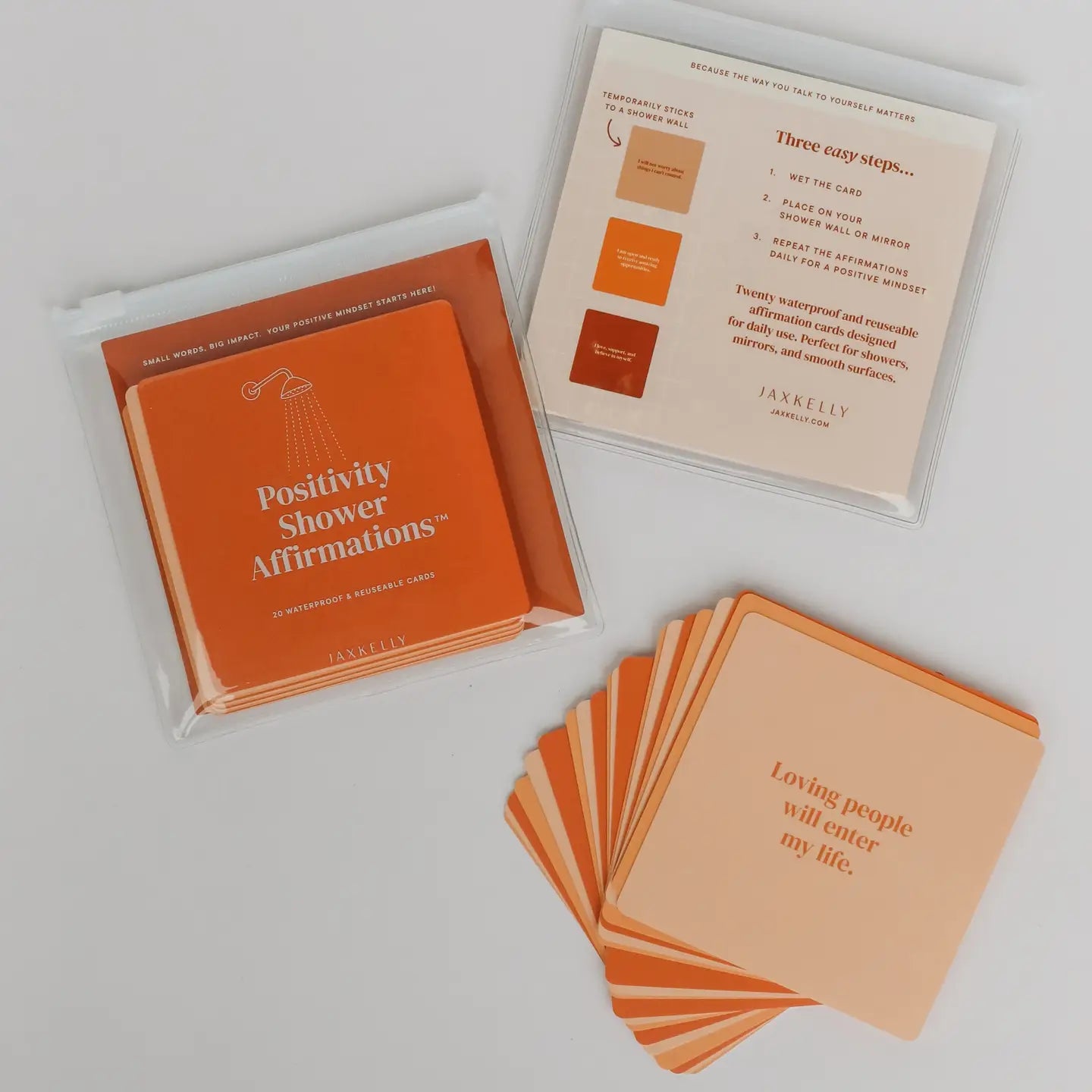JaxKelly Shower Affirmation™ waterproof affirmation cards featuring inspiring messages that cling to shower walls, mirrors, and other smooth surfaces.